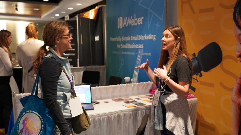 Podcaster meeting with a Resonate Team member at a podcast conference in 2019