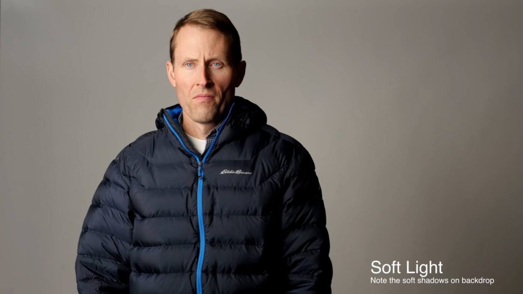 Example of soft lighting on a man in front of a gray background