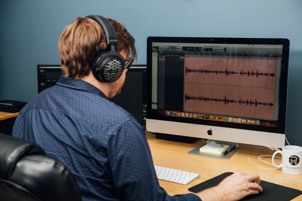 Man editing a podcast in ProTools