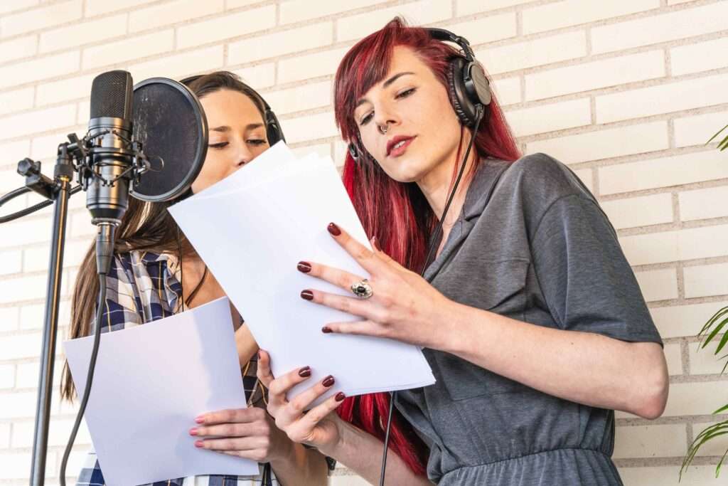 Two women with a microphone